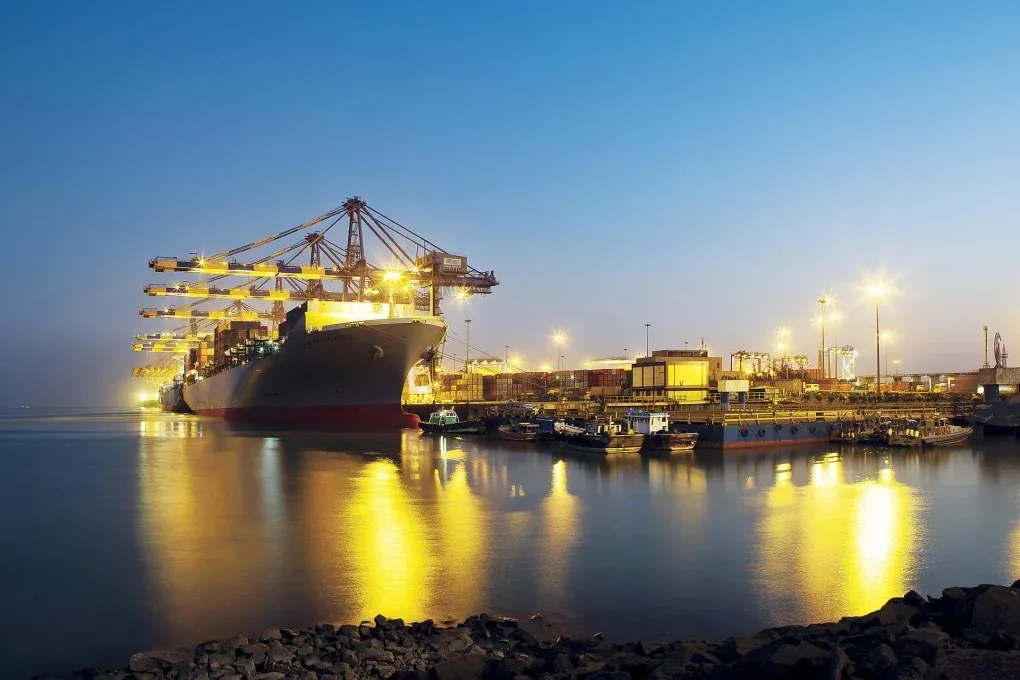 Aerial view of a container port and its berths at dusk
